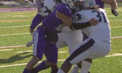 A group of football players competing in a city championship game.