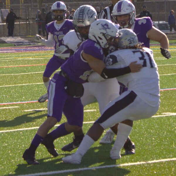 A group of football players competing in a city championship game.