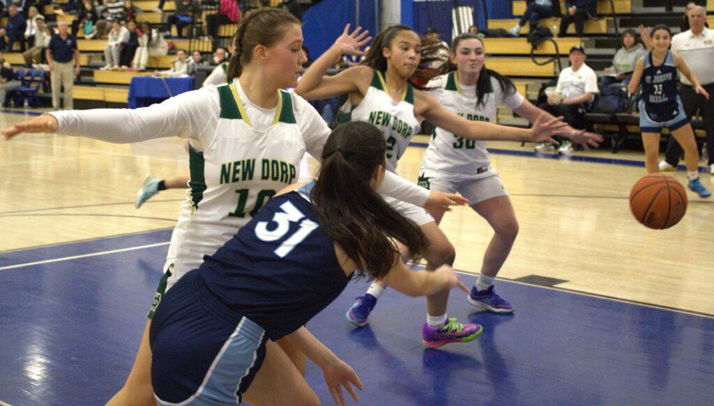 A group of girls from S.I. High School competing in the borough president's tournament championship, playing basketball on Sea Hill.