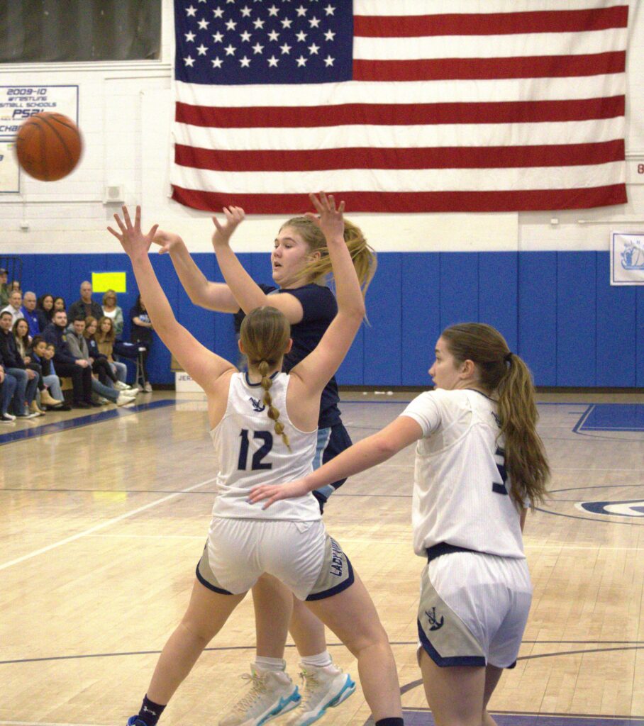 A group of girls participating in the Borough President's Cup Tournament basketball game.