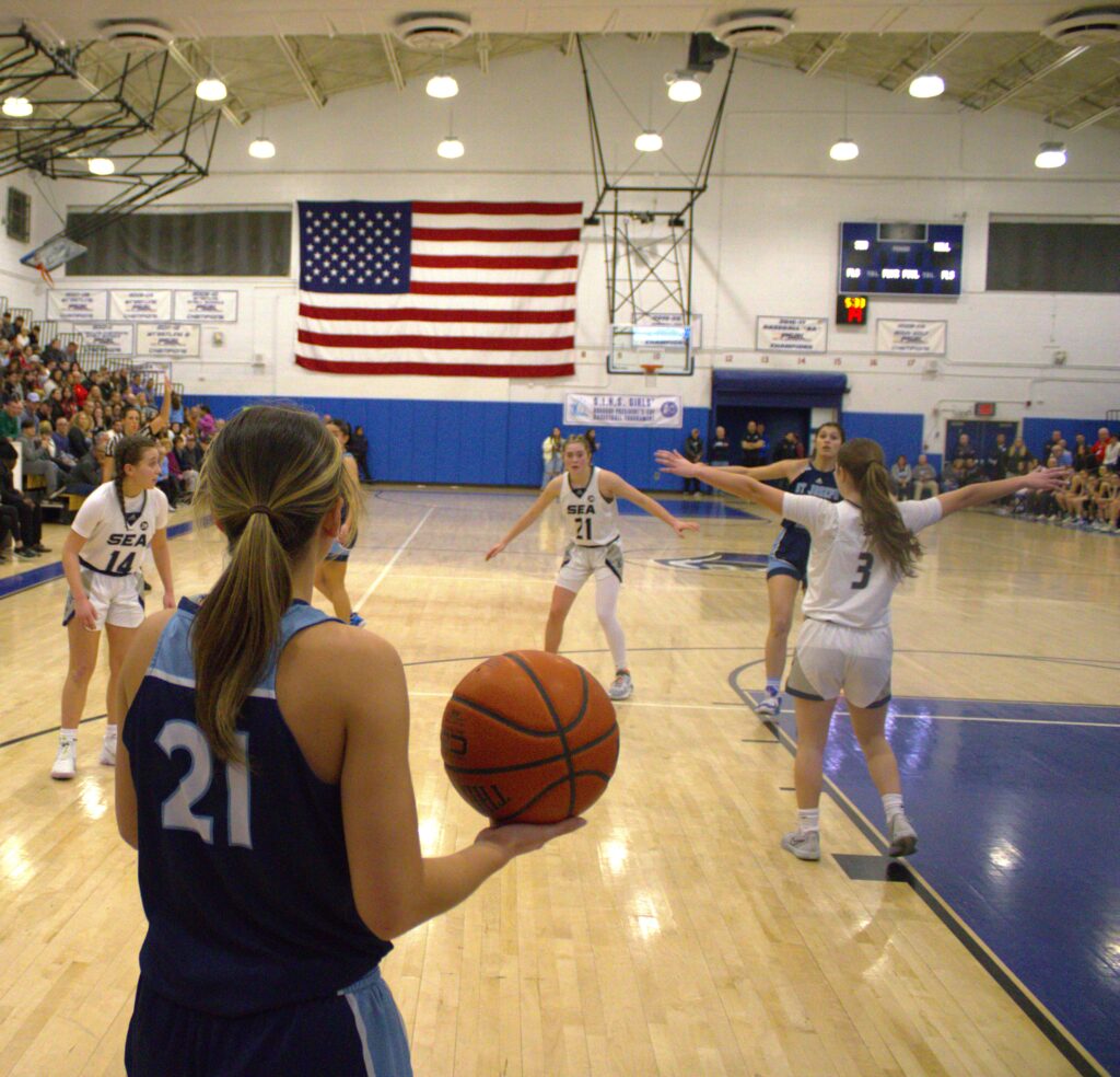 A group of girls playing basketball in the Borough President's Cup Tournament.