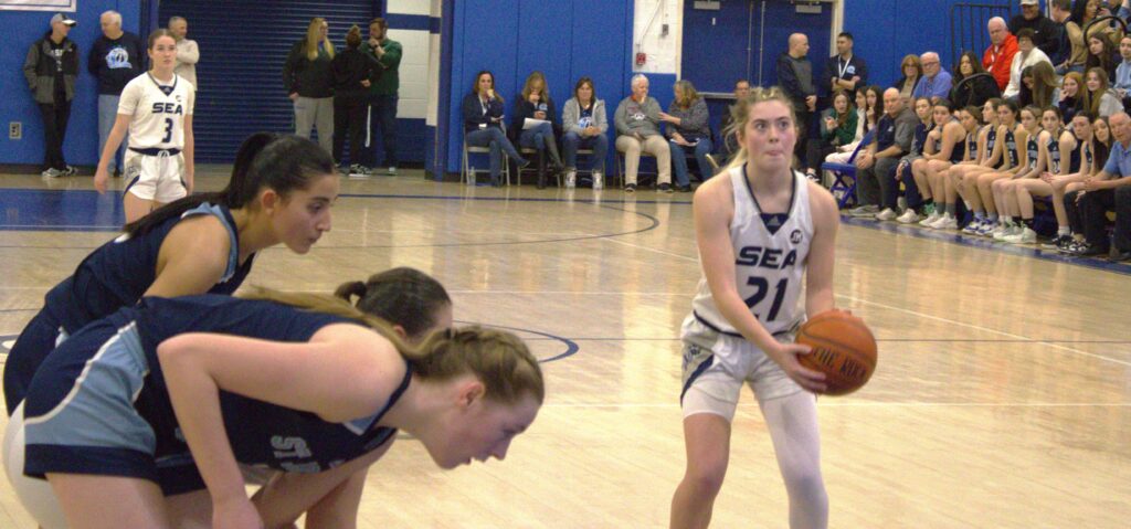 A group of women playing basketball in the Borough President's Cup Tournament.