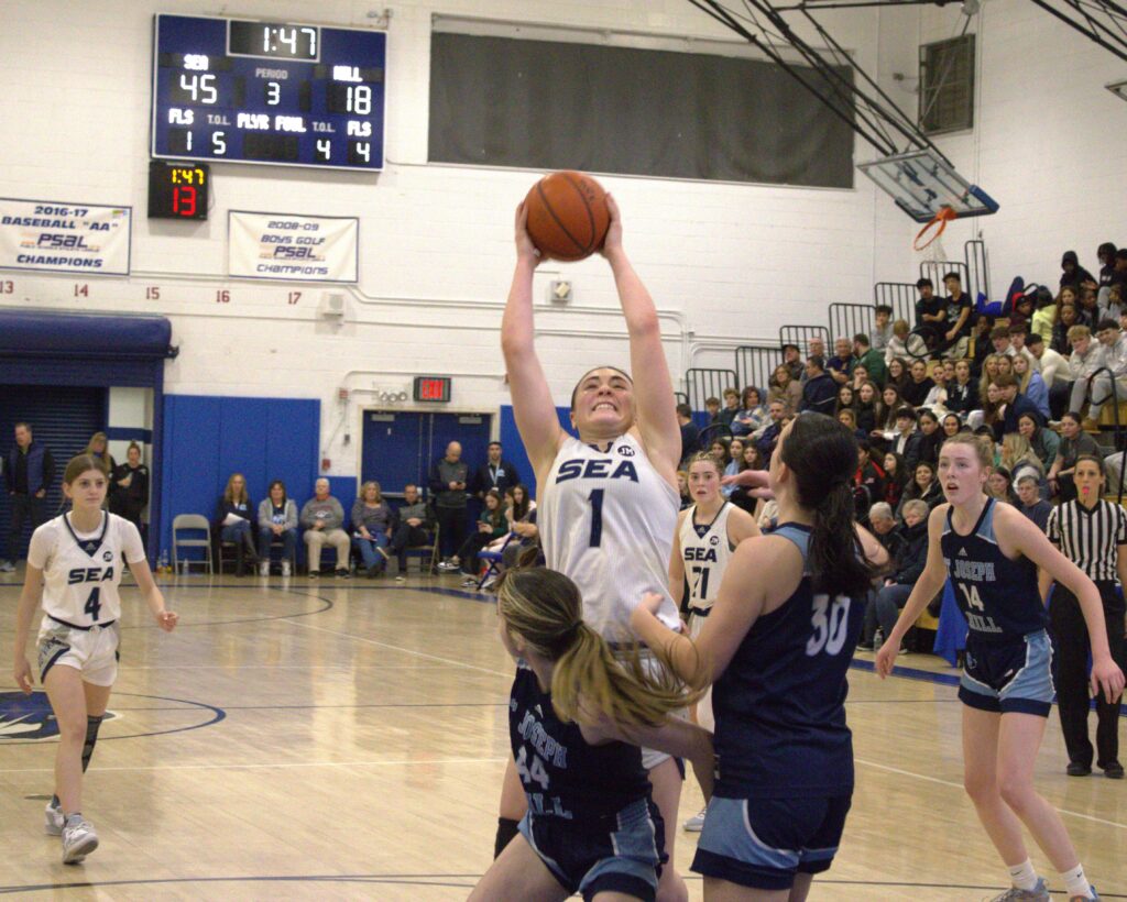 A group of women playing basketball at the Borough President's Cup.