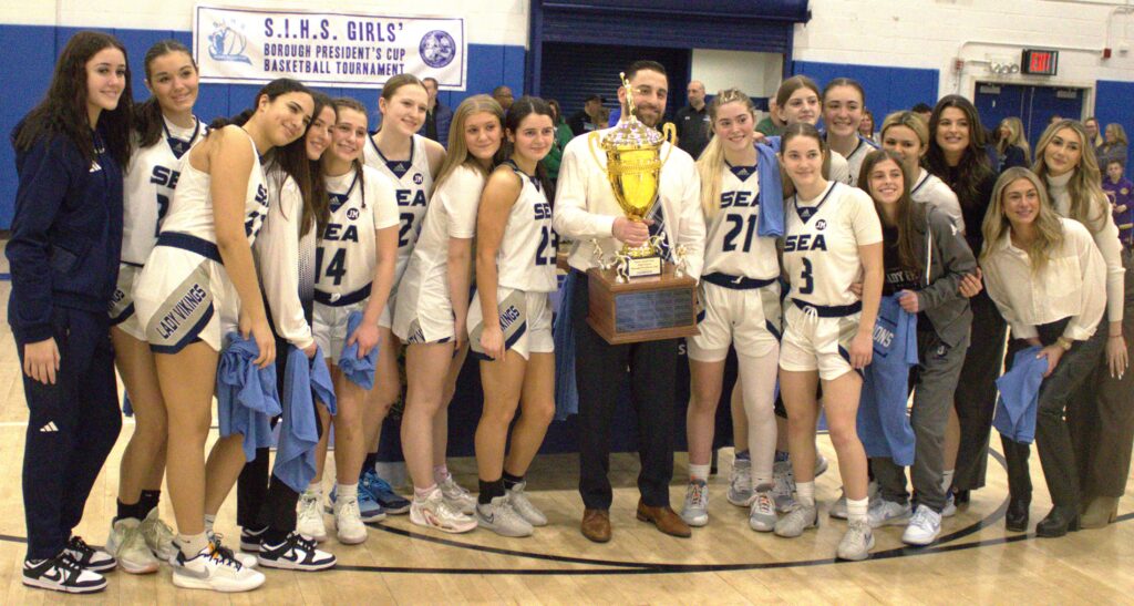 A group of people posing for a photo at the St. Joseph Borough President's Cup.