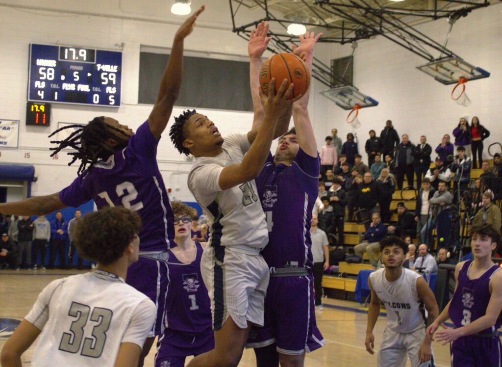 A group of boys from Tottenville playing basketball in the St. Peters gym during the SIHSL Tournament championship.