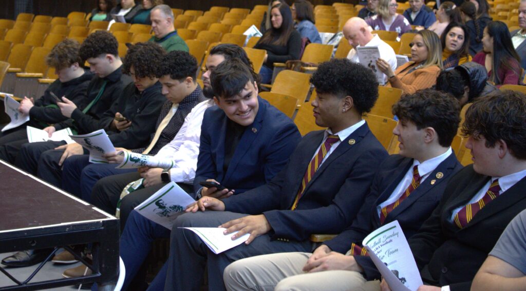 A group of winners seated in an auditorium.